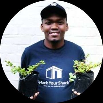 Man presenting seedlings