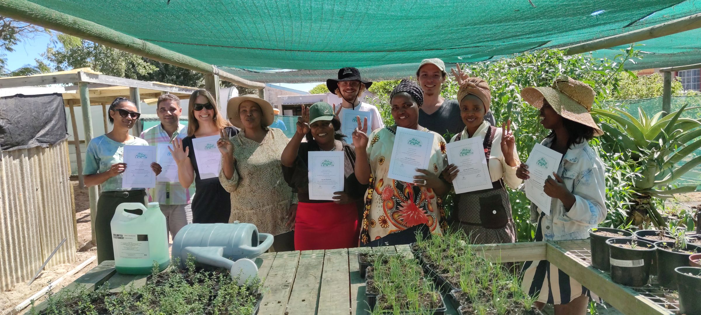 Participants of gardening course with certificates