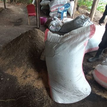 Bags with soil and manure ready to add to pile