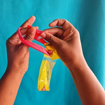 Thread the right hand part of the T through the left hand part of the T