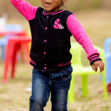 Girl throws ball