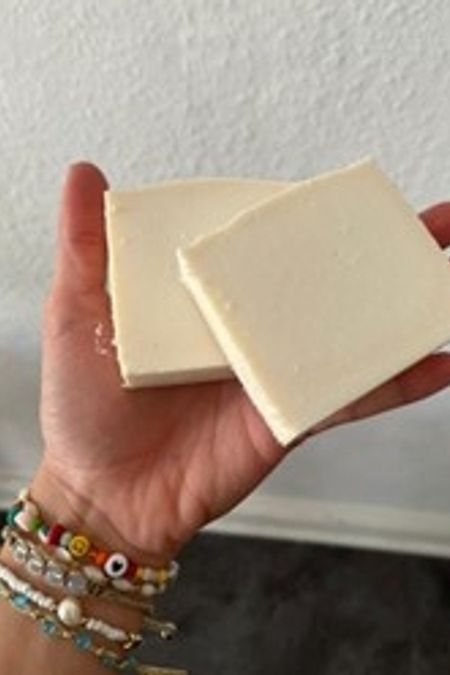 hand with ready made bar soap